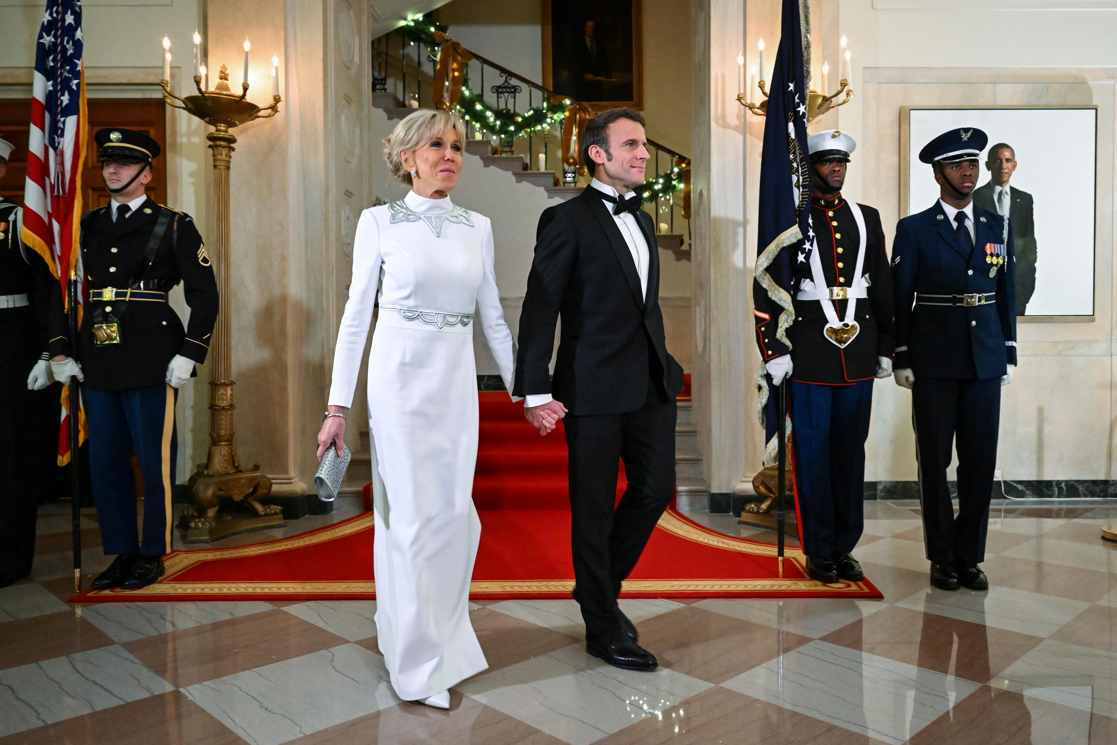 US President Joe Biden and First Lady Jill Biden welcome French President Emmanuel Macron and his wife Brigitte Macron to the White House for a state dinner in Washington, DC, on December 1, 2022. (Photo by SAUL LOEB / AFP)