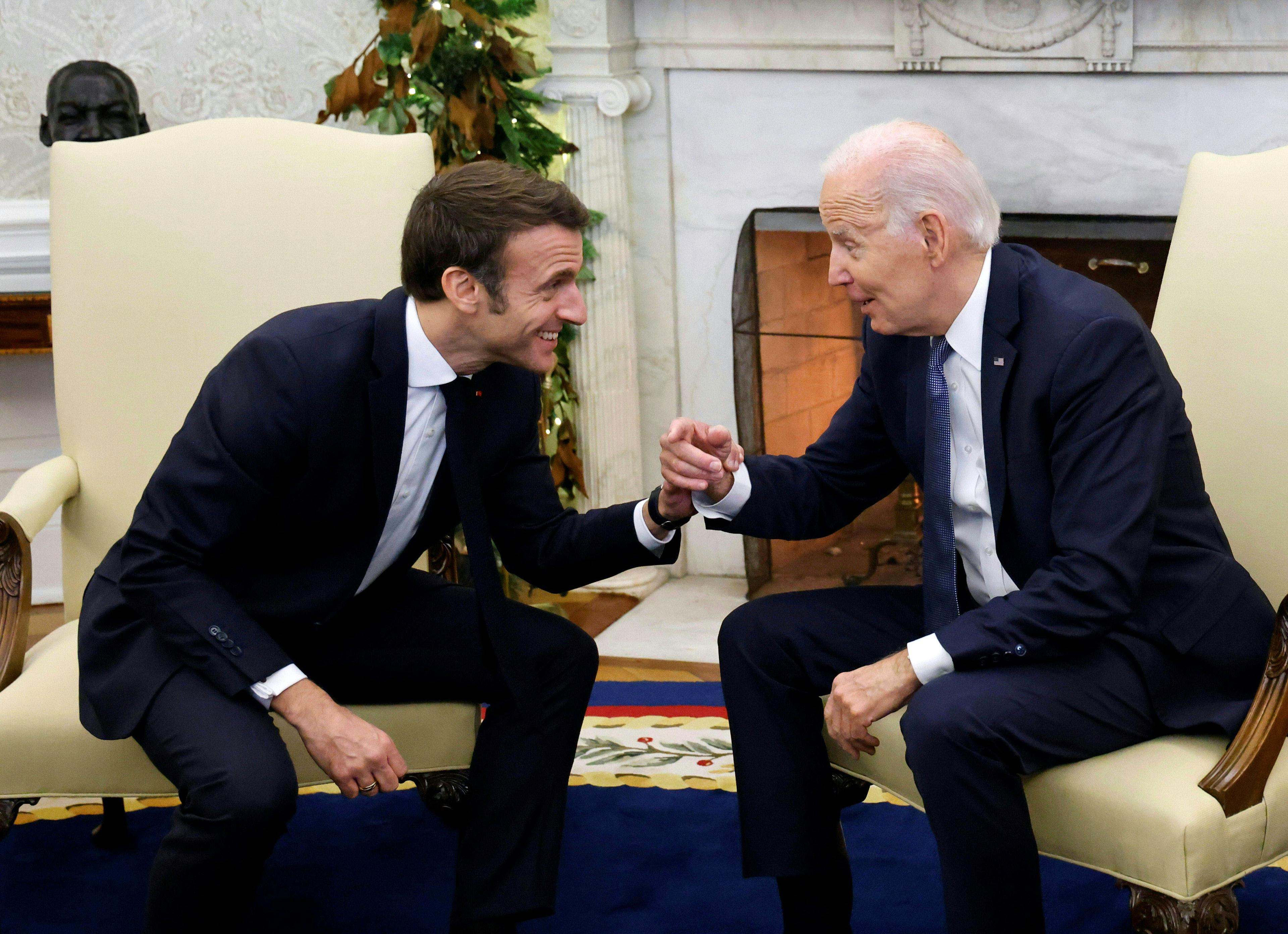 US President Joe Biden (R) meets with French President Emmanuel Macron in the Oval Office of the White House in Washington, DC, on December 1, 2022. (Photo by Ludovic MARIN / AFP)