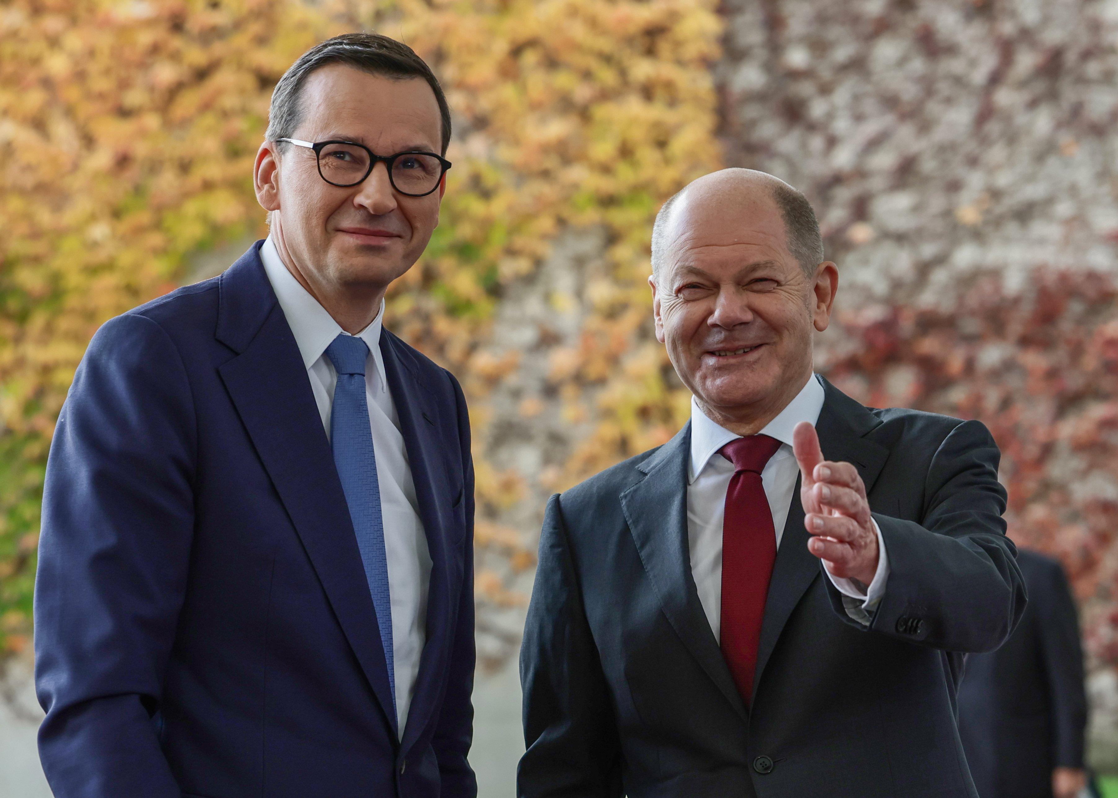 Poland's Prime Minister Mateusz Morawiecki is welcomed by German Chancellor Olaf Scholz for the Berlin Process 2022 Western Balkans Summit at the Chancellery in Berlin on November 3, 2022. (Photo by Jens Schlueter / AFP)