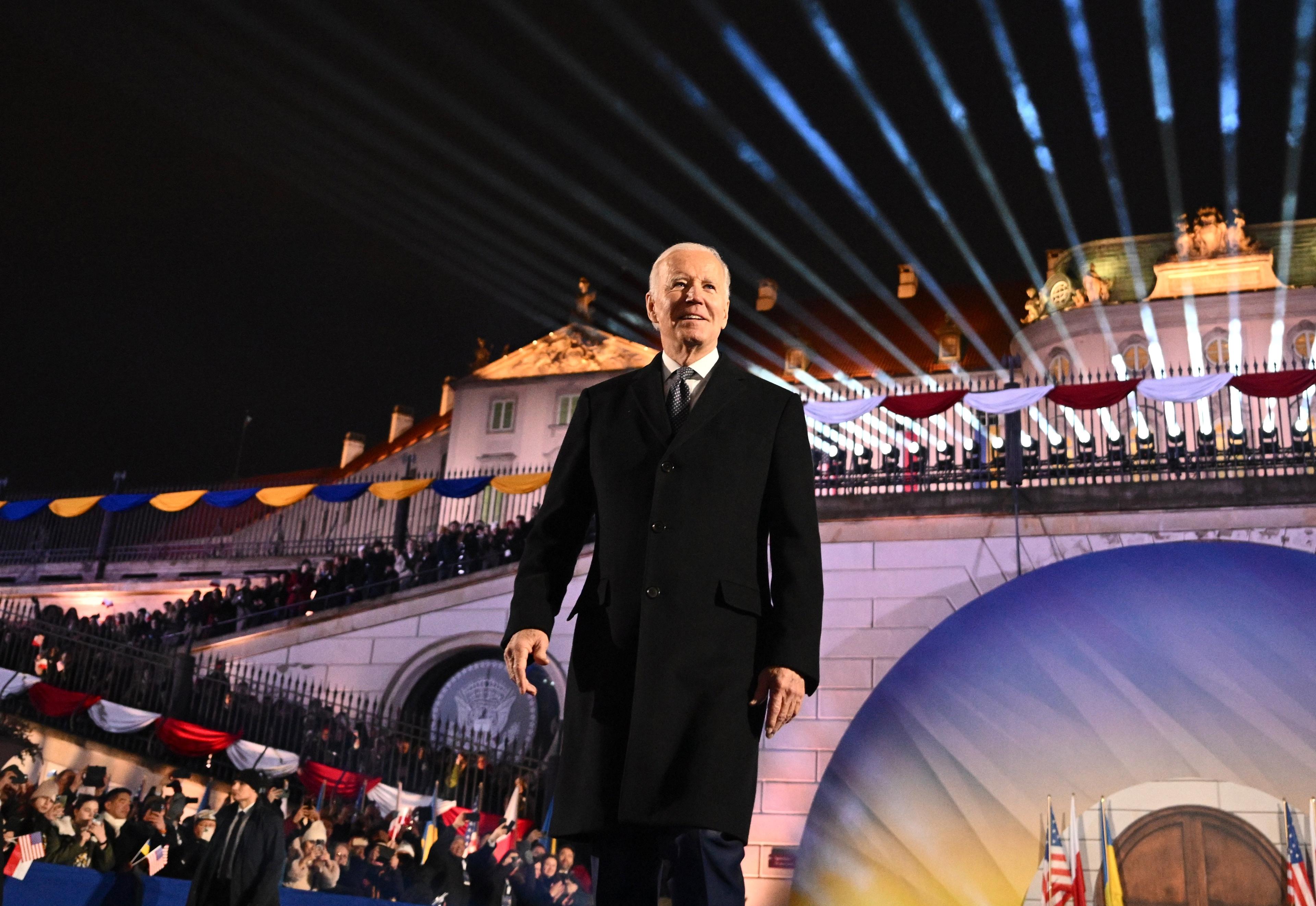 US President Joe Biden walks on stage upon arrival to deliver a speech at the Royal Warsaw Castle Gardens in Warsaw on February 21, 2023. (Photo by Mandel NGAN / AFP)