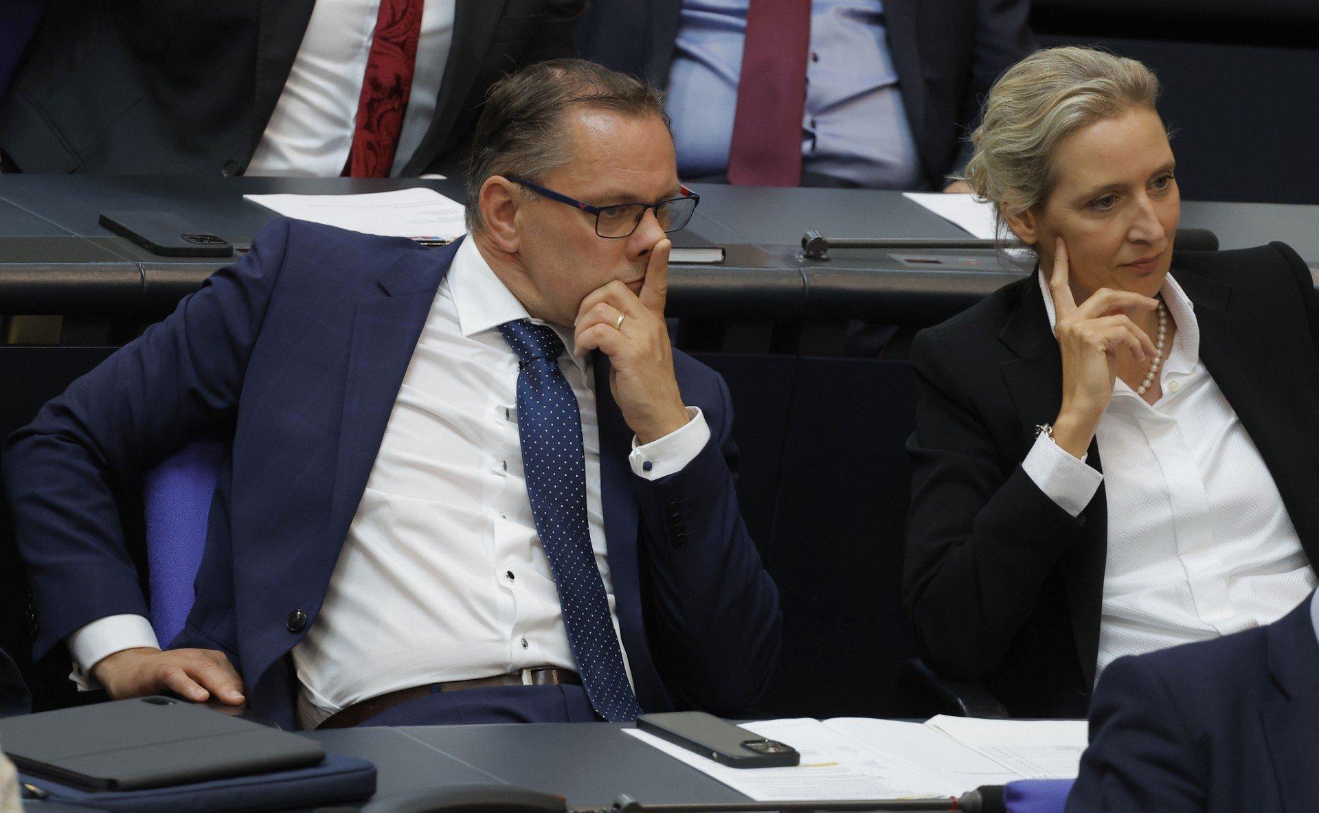 Alice Weidel (R) and Tino Chrupalla, both co-leaders and also parliamentary group co-leaders of the far-right Alternative for Germany (AfD) party, attend a debate on June 22, 2023 at the Bundestag, the lower house of parliament, in Berlin, ahead of the EU summit. (Photo by Odd ANDERSEN / AFP)