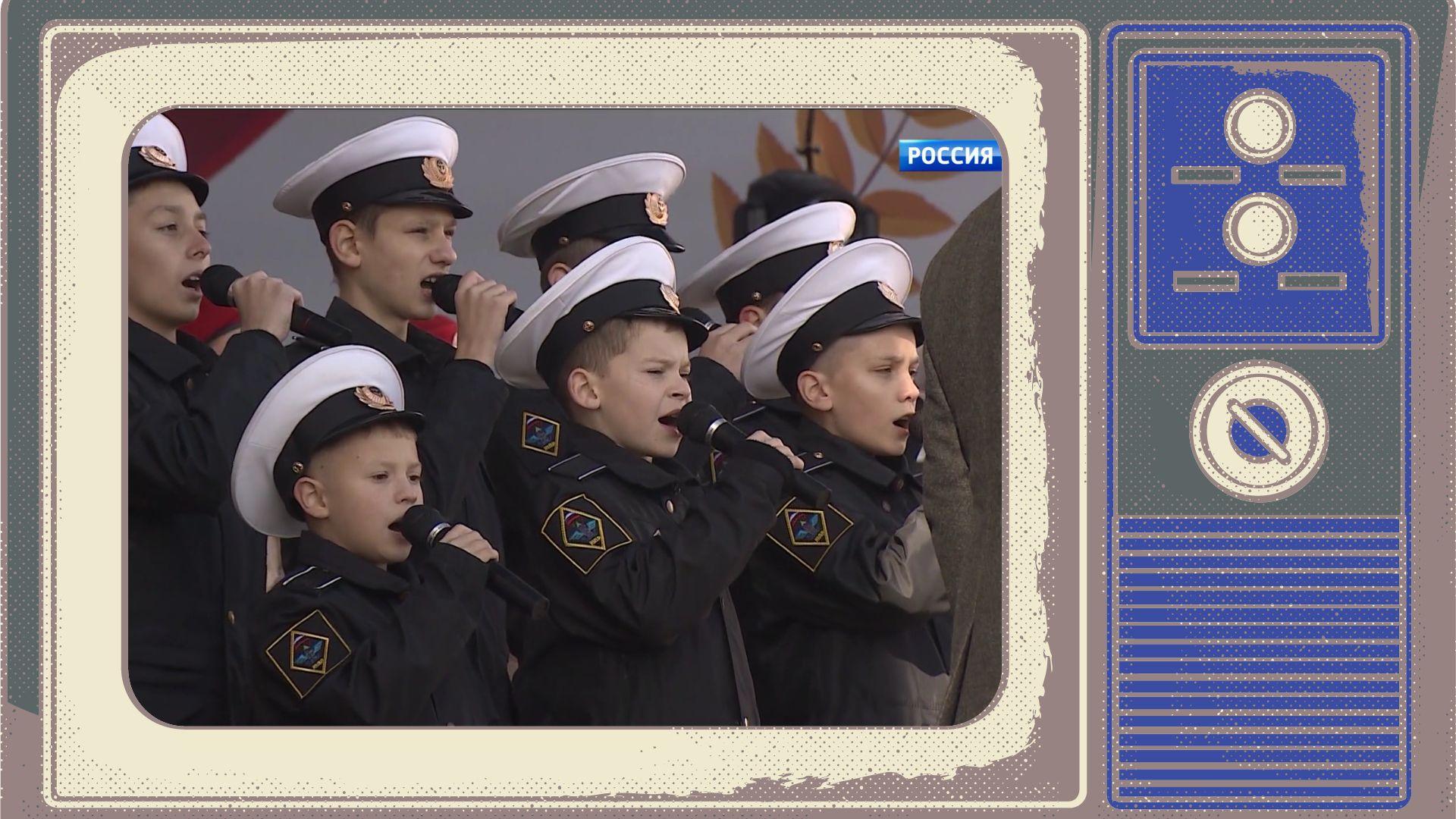 Grafika - w ramce starego telewizora screen przedstawiający dzieci w mundurach wojskowych śpiewające hymn Rosji
