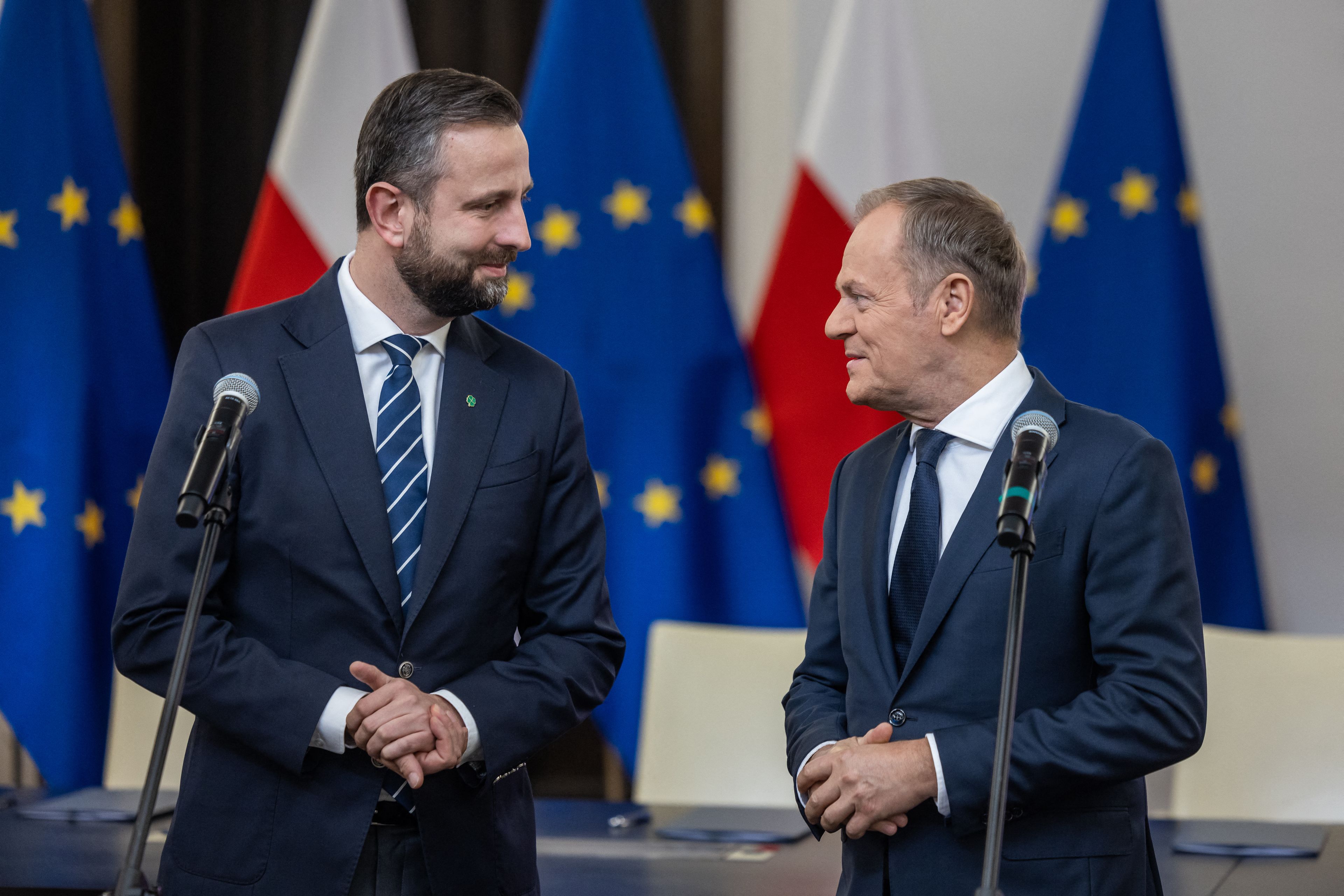 Leaders of the Polish liberal opposition parties Wladyslaw Kosiniak Kamysz (L) of the Third Way party, and Donald Tusk of the Civic Coalition, give a joint press statement prior to the signing of the coalition deal, at the Polish parliament in Warsaw on November 10, 2023. Poland's liberal opposition parties on November 10,2023 signed a coalition deal they said would be a "roadmap" for the new alliance if it was given the chance to take power. (Photo by Wojtek Radwanski / AFP)
