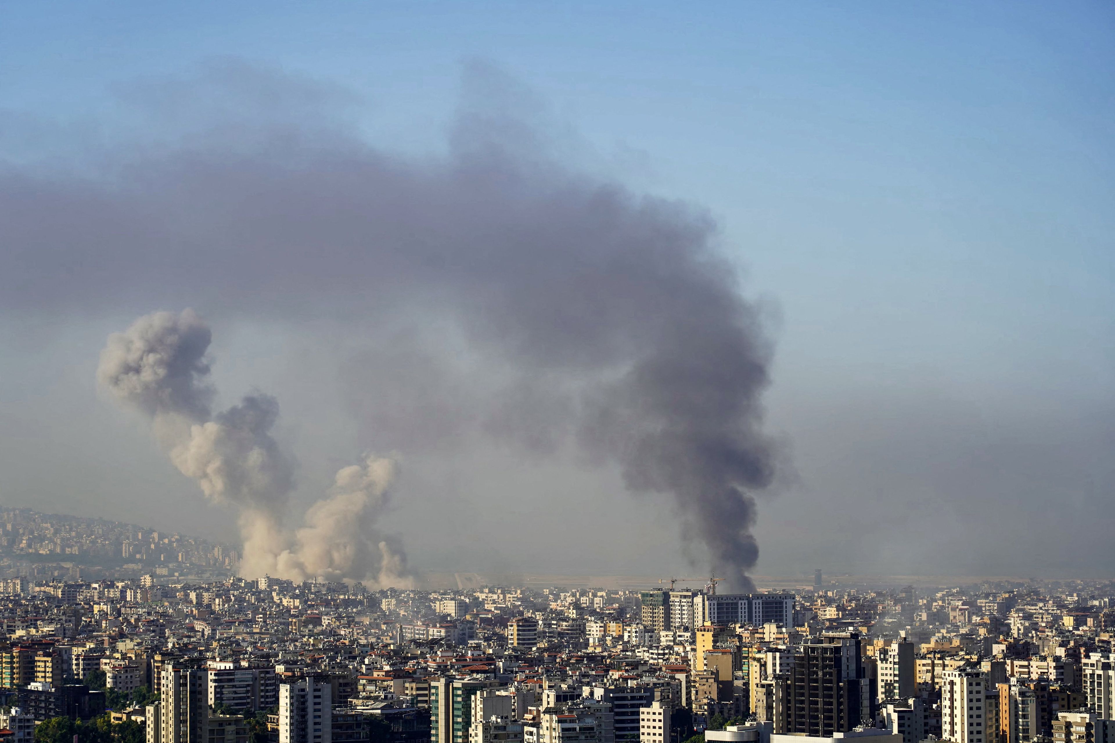 Smoke rises from the site of an Israeli airstrike that targeted Beiruts southern suburbs on October 5, 2024. (Photo by ETIENNE TORBEY / AFP)