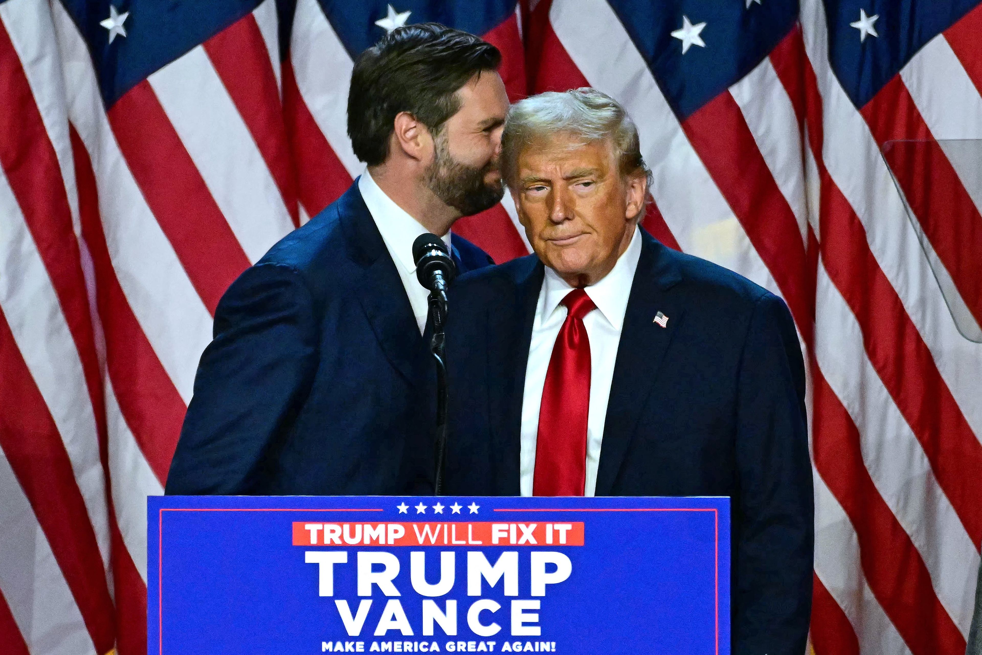 US Senator from Ohio and Republican vice presidential candidate J.D. Vance (L) walks away after speaking alongside former US President and Republican presidential candidate Donald Trump during an election night event at the West Palm Beach Convention Center in West Palm Beach, Florida, on November 6, 2024. - Republican former president Donald Trump closed in on a new term in the White House early November 6, 2024, just needing a handful of electoral votes to defeat Democratic Vice President Kamala Harris. (Photo by Jim WATSON / AFP)