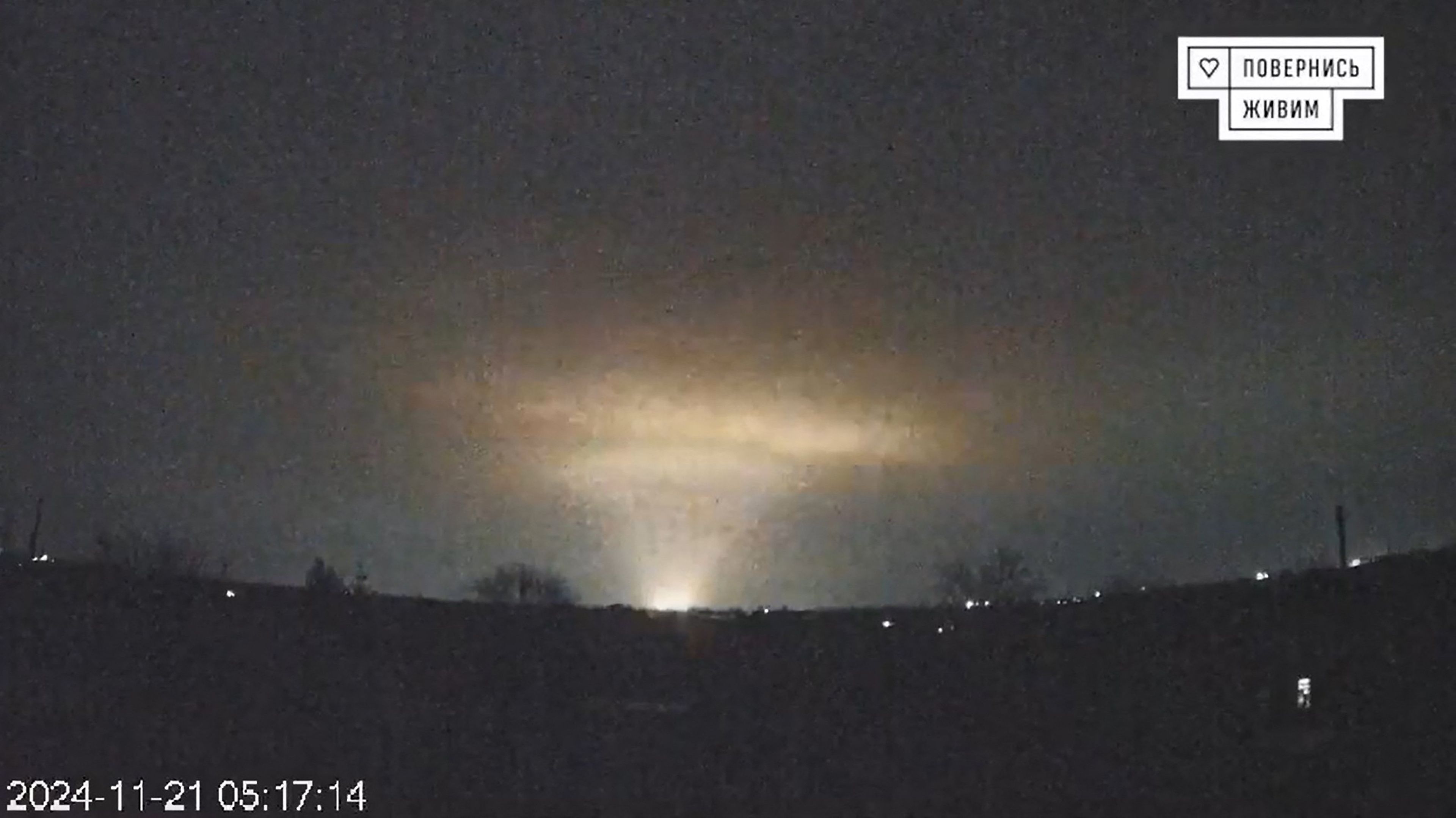 A grab taken from footage released online on November 21, 2024 by the Ukrainian charity "Come Back Alive" shows flashes over the Ukrainian city of Dnipro. - Kyiv accused Russia of launching an intercontinental ballistic missile attack at Ukraine for the first time on November 21, 2024 but without a nuclear warhead in a new escalation of the conflict. (Photo by COME BACK ALIVE / AFP) / NO USE AFTER NOVEMBER 30, 2024 14:56:50 GMT - RESTRICTED TO EDITORIAL USE - MANDATORY CREDIT "AFP PHOTO / COME BACK ALIVE" - NO MARKETING NO ADVERTISING CAMPAIGNS - DISTRIBUTED AS A SERVICE TO CLIENTS