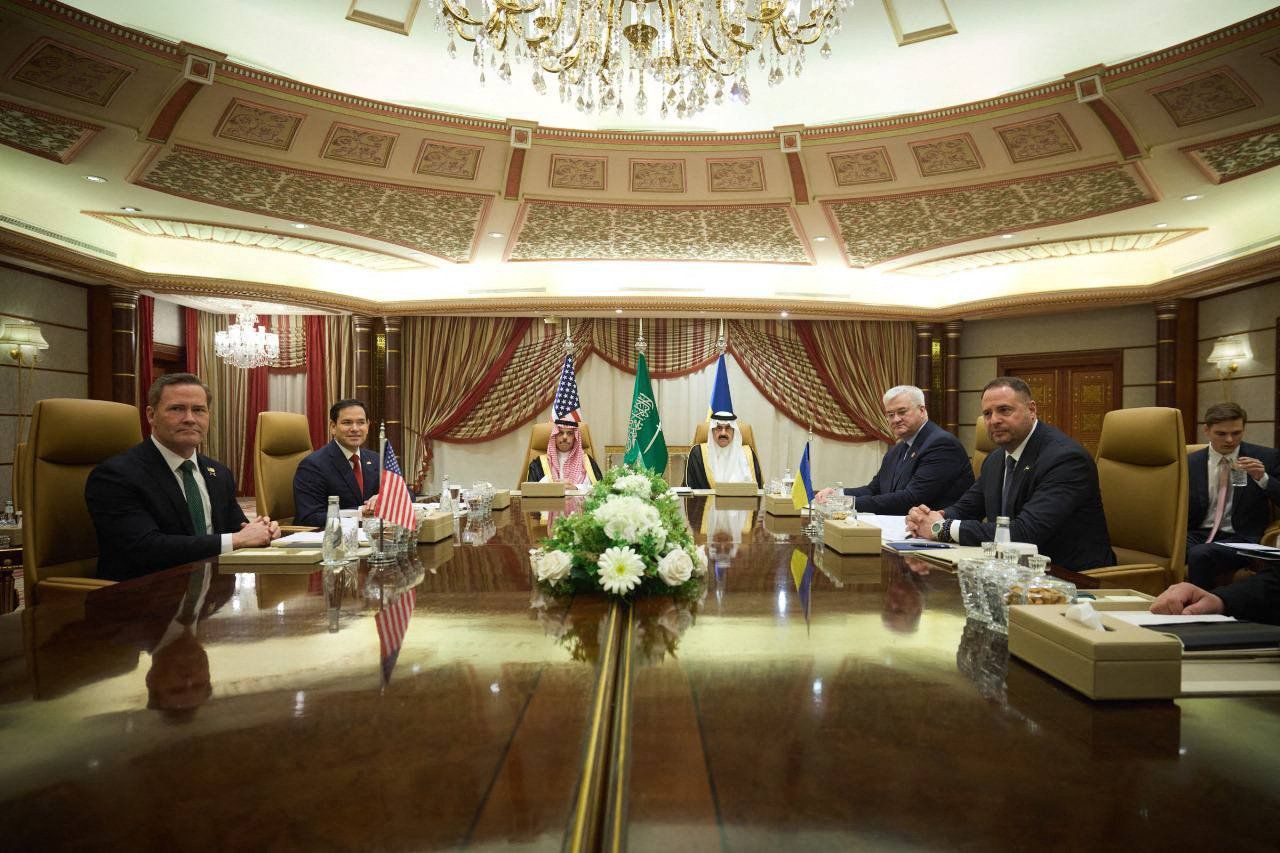 This handout photograph released in Jeddah by the official Telegram channel of Ukraine's Head of the Office of the President Andriy Yermak on March 11, 2025 shows Ukraine's Head of the Office of the President Andriy Yermak (R), Ukrainian Minister of Foreign Affairs Andriy Sybiga (2nd R), US Secretary of State Marco Rubio (2nd L) and US National Security Advisor Michael Waltz (L) posing at the beginning of the Ukrainian and US delegations meeting, amid the Russian invasion of Ukraine. (Photo by Handout / Telegram /@ermaka2022 / AFP) / RESTRICTED TO EDITORIAL USE - MANDATORY CREDIT "AFP PHOTO / OFFICIAL TELEGRAM CHANNEL OF THE HEAD OF THE OFFICE OF THE PRESIDENT OF UKRAINE ANDRIY YERMAK  " - NO MARKETING NO ADVERTISING CAMPAIGNS - DISTRIBUTED AS A SERVICE TO CLIENTS