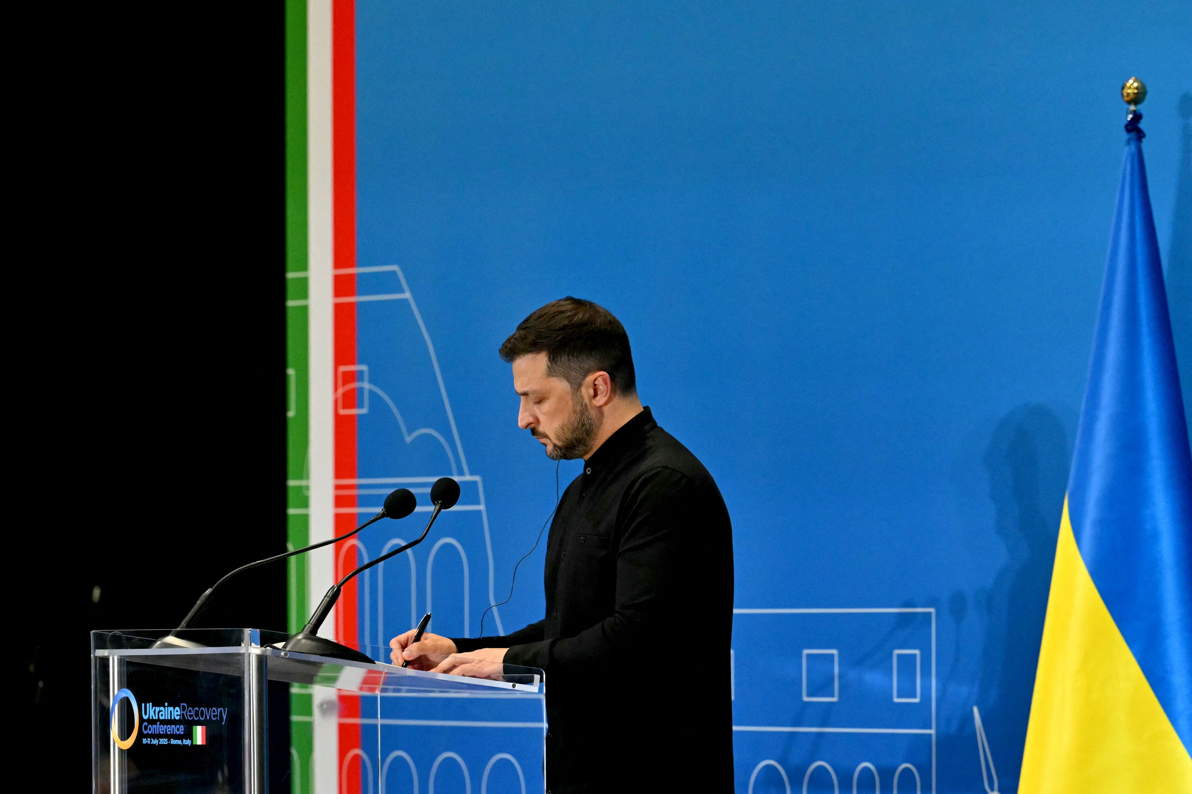 Ukraine's President Volodymyr Zelensky addresses a press conference during The Ukraine Recovery Conference 2025 (URC2025) at The Roma Convention Centre in Rome on July 10, 2025. The meeting of international leaders is aimed at mobilising support -- including private investment -- for the reconstruction of Ukraine, even as Russia steps up its attacks. (Photo by Andreas SOLARO / AFP)