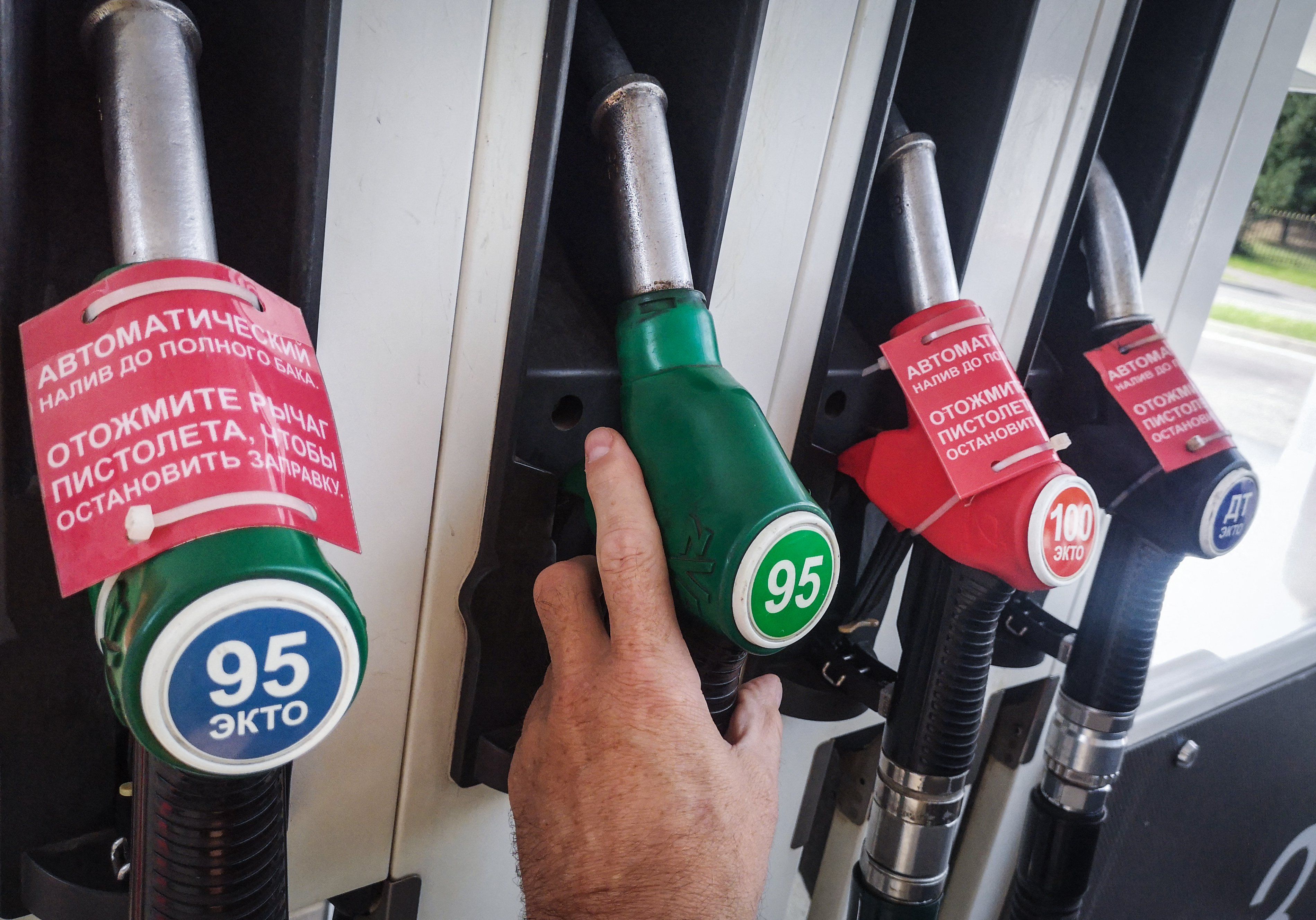 A man fills up his car at a gas station in Moscow on September 8, 2025. Retail gasoline prices have reached new heights and have been growing faster than overall inflation since August. In Moscow, gasoline prices have approached 67 rubles per liter (US$0.82), and have risen by 3-4 rubles since the beginning of 2025. (Photo by Alexander NEMENOV / AFP)