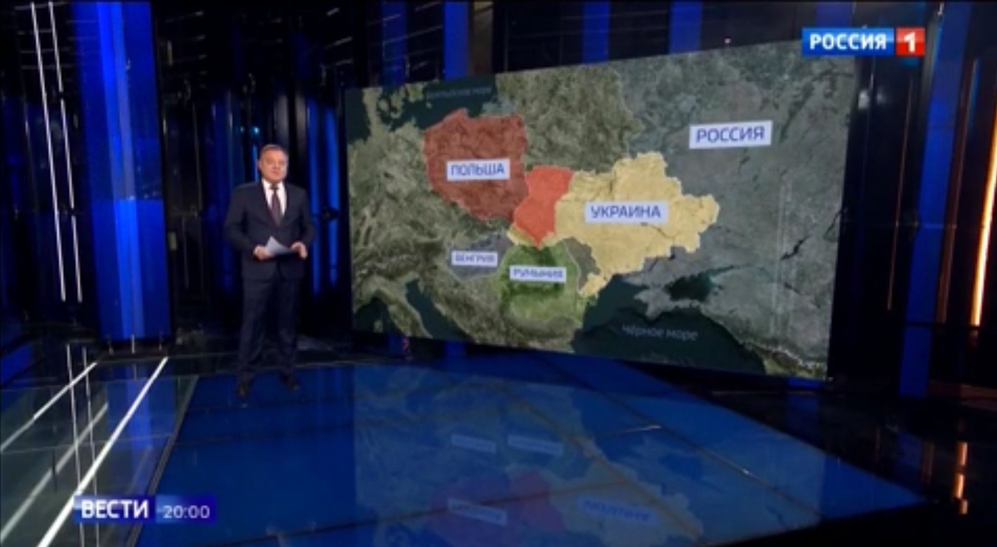 Mapa Ukrainy podzielonej z Polską na ekranie w rosyjskim studiu telewizyjnym. Napisy rosyjskie